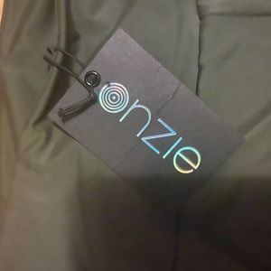 Onzie leggings.  M/L Green NWT
